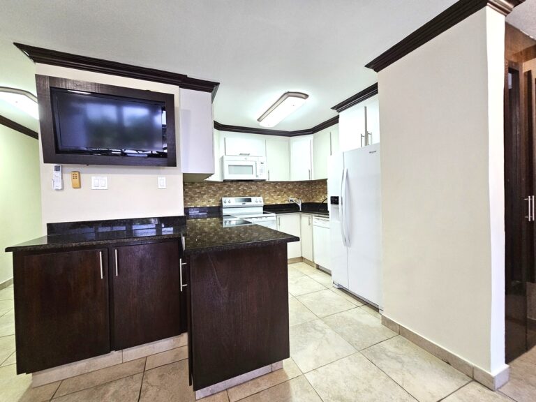 Kitchen with brand new Refrigerator, stove and microwaveV